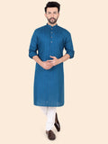 Man wearing a blue kurta with white pants