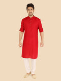 Man wearing a red kurta with white pants