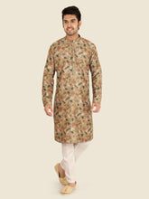 Man wearing a patterned pista kurta with white pants
