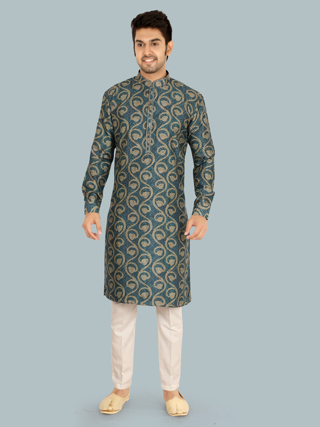 Man wearing a patterned blue kurta with white pants
