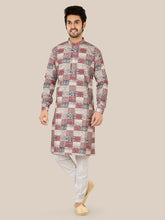 Man wearing a patterned gray kurta with white pants