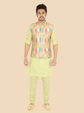 Man wearing a light green or parrot green kurta with a colorful vest