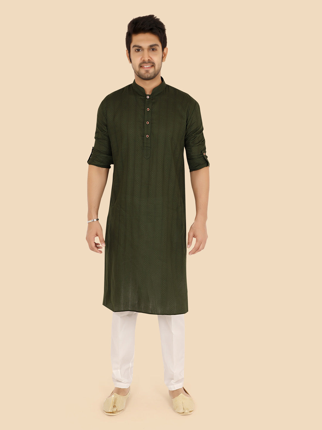 Man wearing a mehandi kurta with white pants