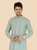 Man wearing a green patterned kurta with pants