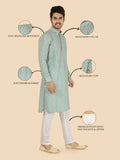Man wearing a green kurta with highlighted features 