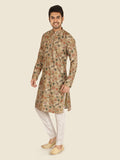 Man wearing a patterned pista kurta with white pants 