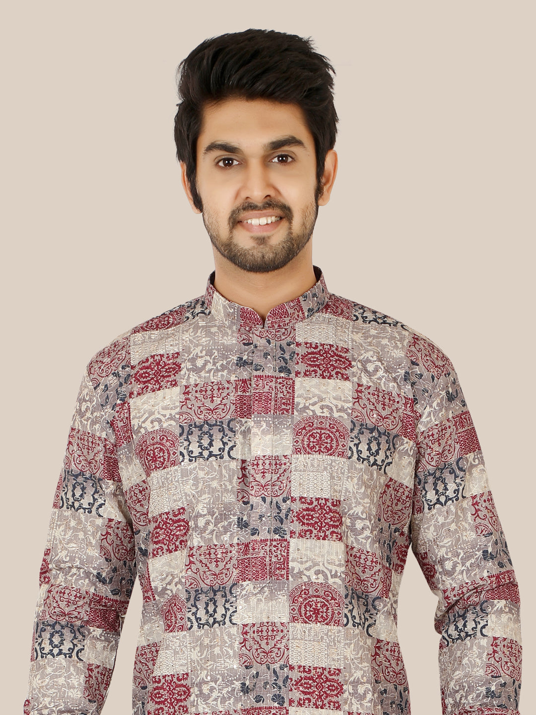 Man wearing a patterned gray kurta
