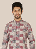 Man wearing a patterned gray kurta