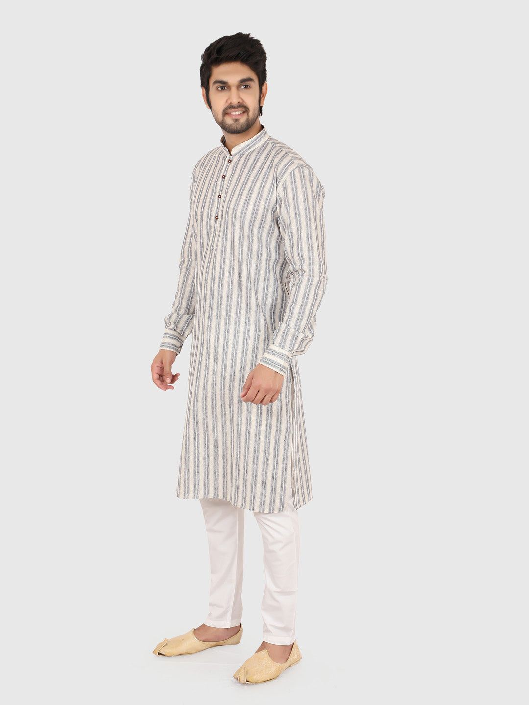 Man wearing a gray striped kurta with white pants