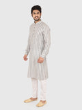 Man wearing a gray striped kurta with white pants