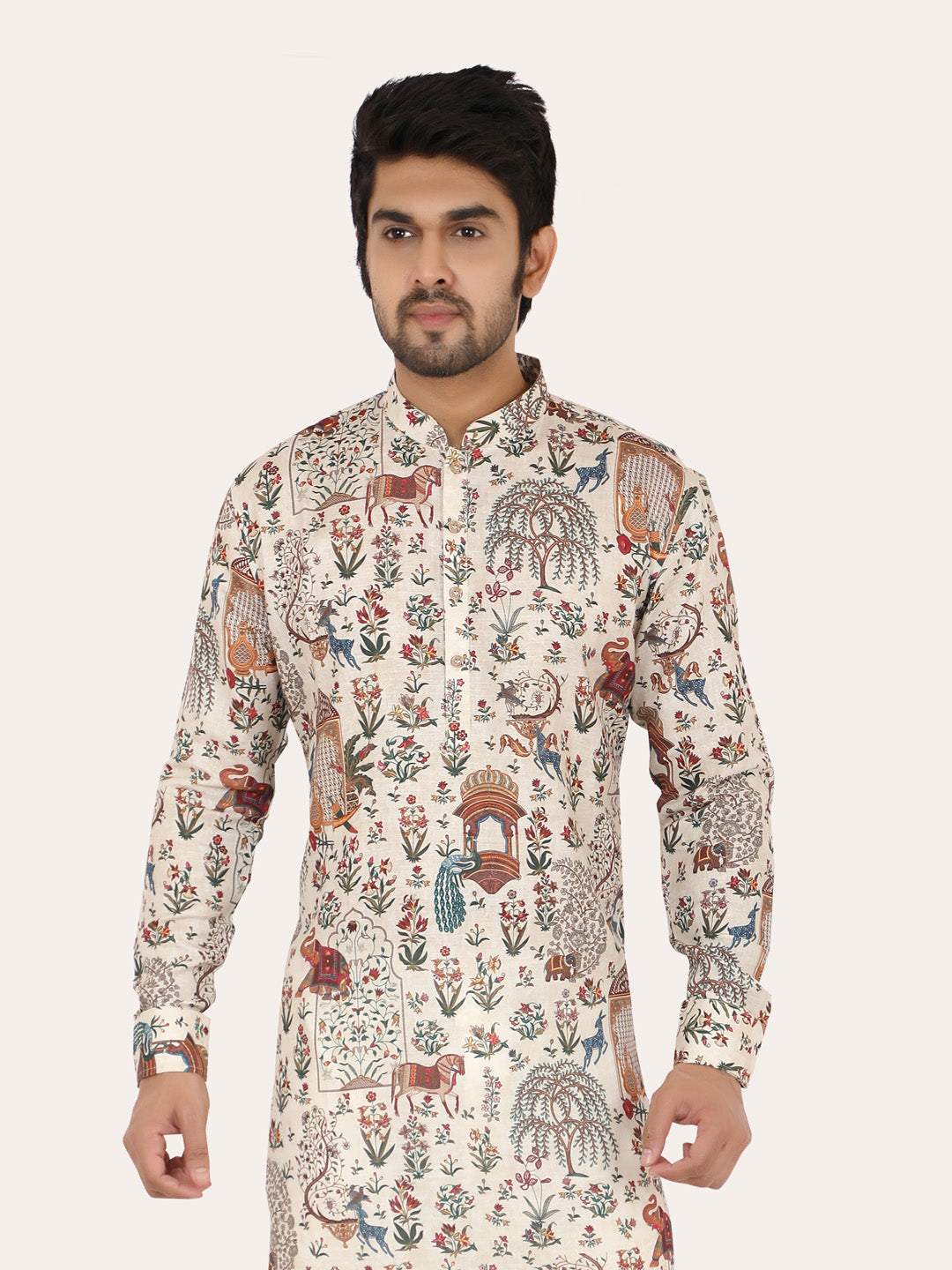 Man wearing a patterned cream kurta