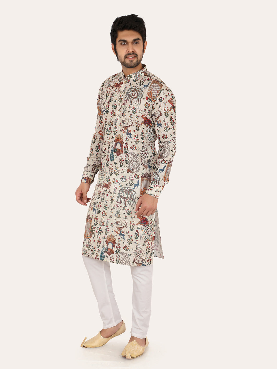 Man wearing a patterned cream kurta with white pants