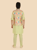 Person wearing a light green or parrot green  kurta with a colorful vest 