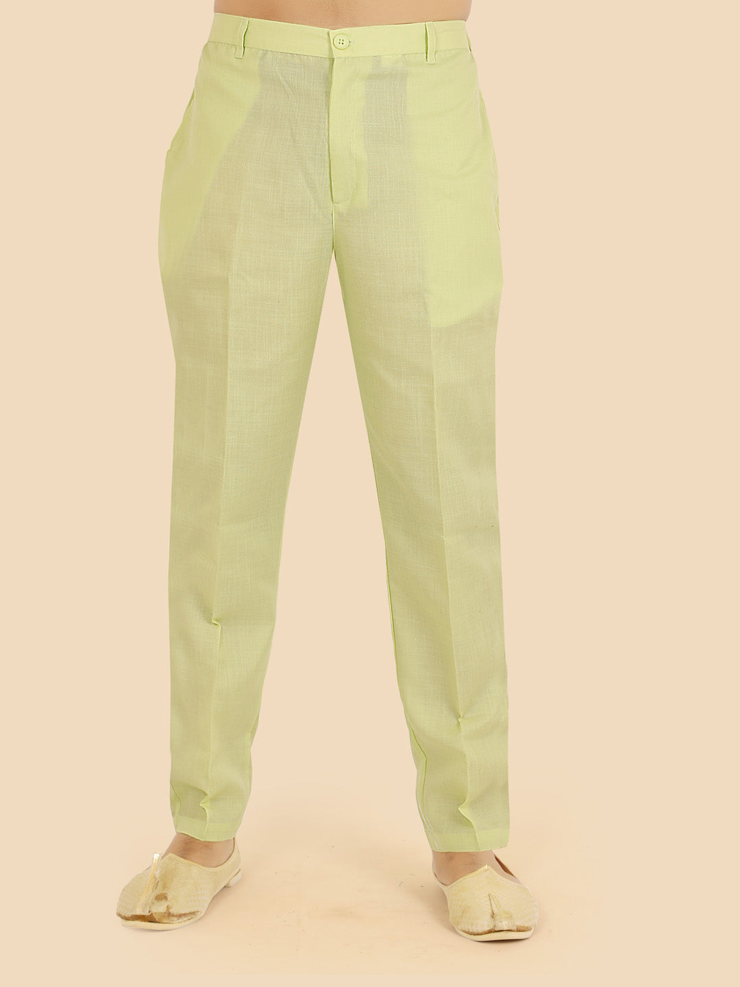 Light green  or parrot green pants worn by a person 